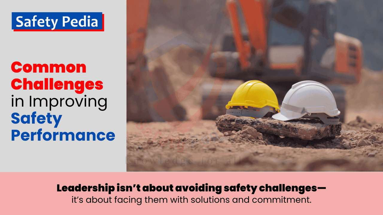 Common Challenges in Improving Safety Performance - Two construction helmets (yellow and white) placed on a rock at a construction site with excavators in the background. Safety Pedia motivational quote about leadership facing safety challenges with solutions and commitment is written on it.